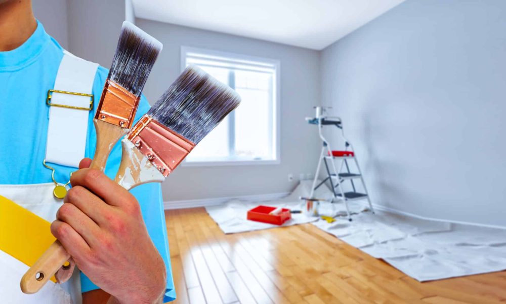 Painter hand with painting brush